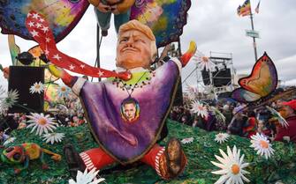 2198643470 VIAREGGIO, ITALY - FEBRUARY 9: The detail of a papier-mache mask representing American President Donald Trump with a sticker of Elon Musk on it, moves through the streets of Viareggio during the traditional Carnival of Viareggio parade on February 9, 2025 in Viareggio, Italy. The Carnival of Viareggio is considered one of the most important carnivals in Italy and is characterised by its giant papier-mache floats depicting caricatures of popular characters, politicians and fictional creations. Said to be one of the most important carnivals in Italy and Europe, the floats are renowned to be the biggest in the world.(Photo by Laura Lezza/Getty Images)