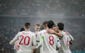 Manchester United TOPSHOT - Manchester United's English midfielder #37 Kobbie Mainoo (hidden) celebrates with team mates after scoring the 0-2 goal during the UEFA Europa league football match between FC Steaua Bucharest and Manchester United, in Bucharest, Romania, on January 30, 2025. (Photo by Andrei PUNGOVSCHI / AFP)